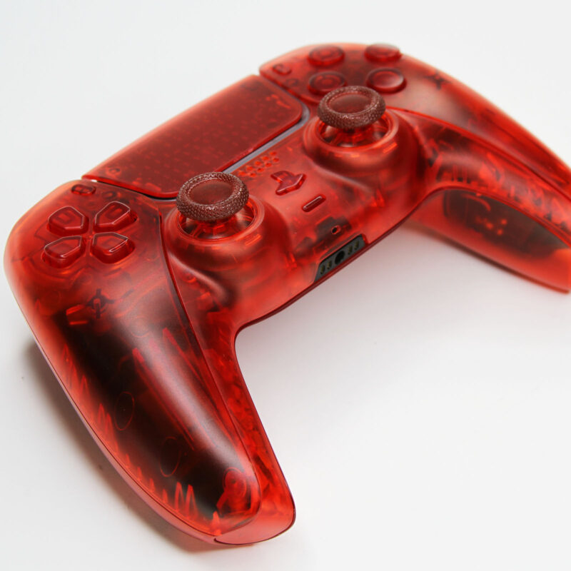 Front left view of Killscreens Triple Clear Red PS5 Controller