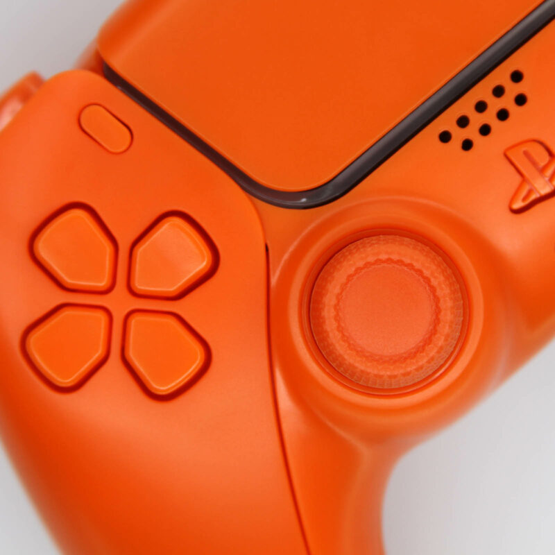 Close up of Solid Orange PS5 Controller D-Pad