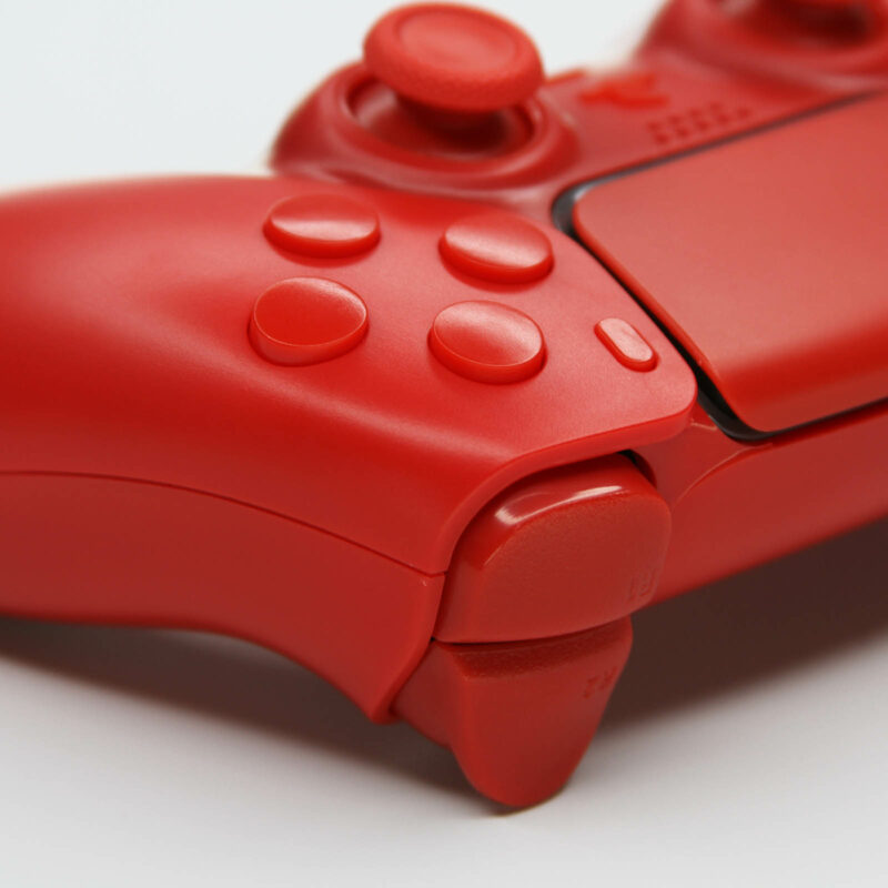 Close up view of Solid Red PS5 Controller by Killscreen