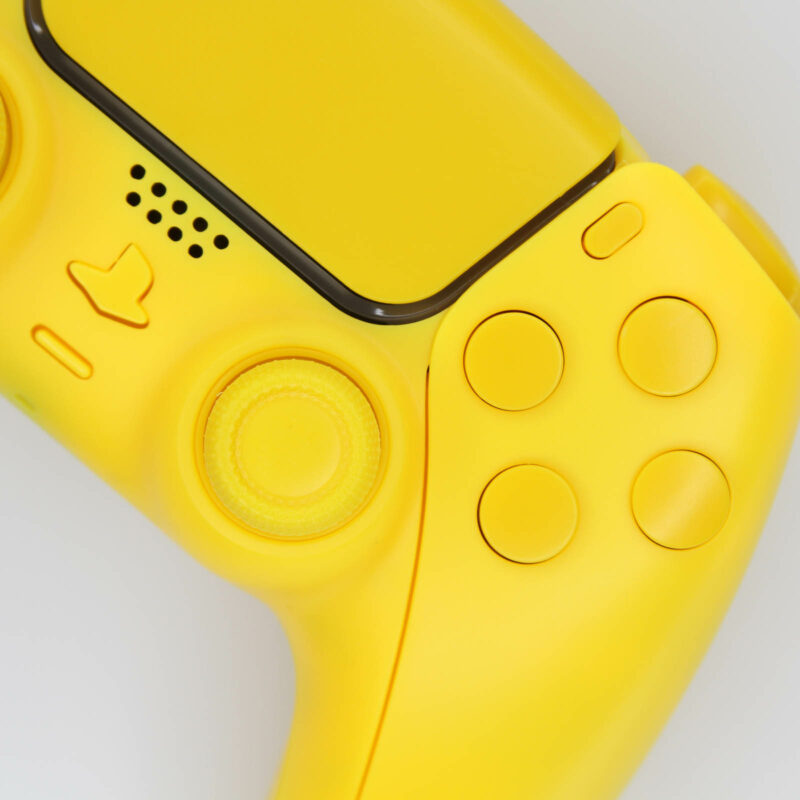 Close up of yellow ps5 controller