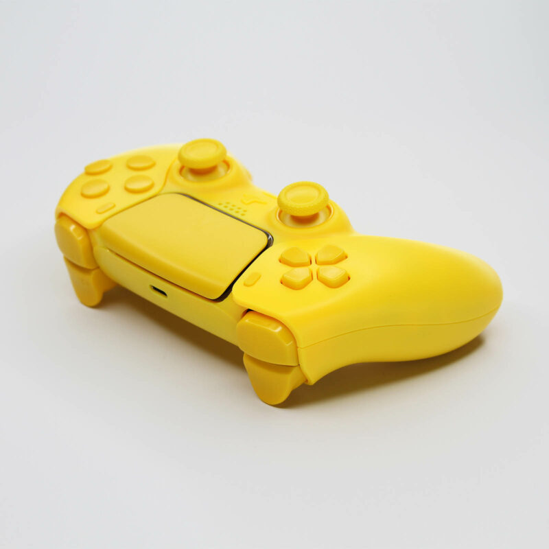 Back left of triple yellow PS5 Controller by killscreen
