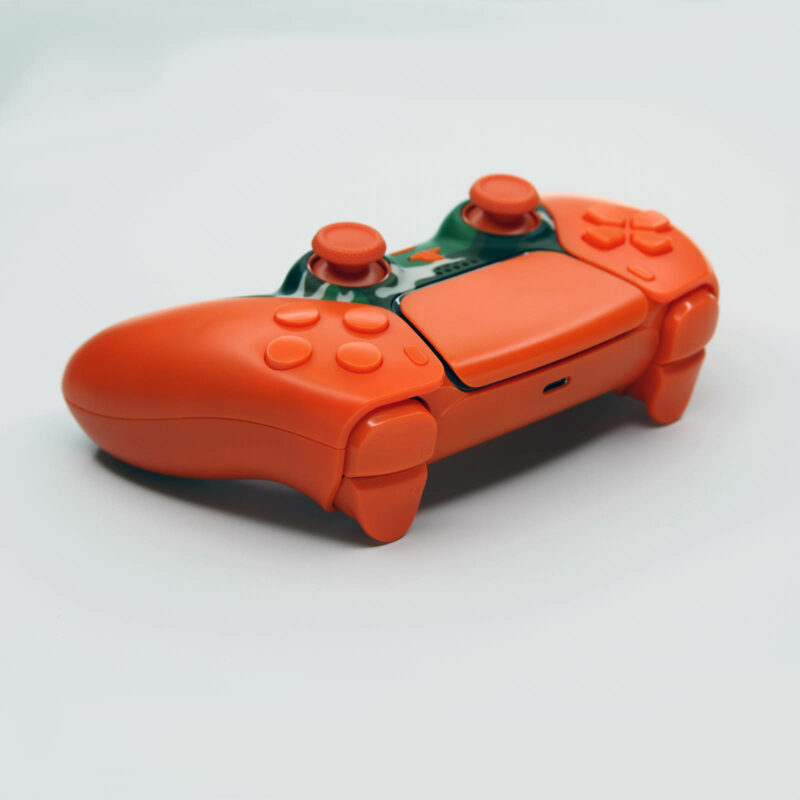 Back right angle of Orange Camo PS5 Controller