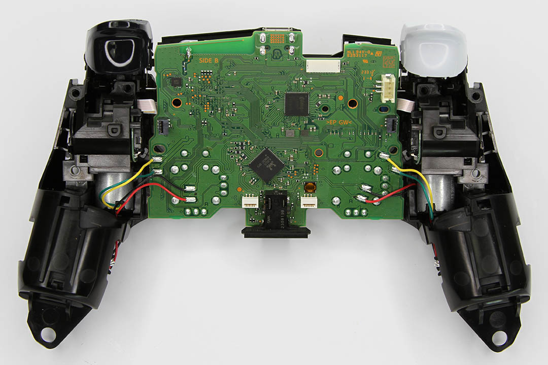 Back of BDM-040 PS5 Controller with back shell removed exposing internals