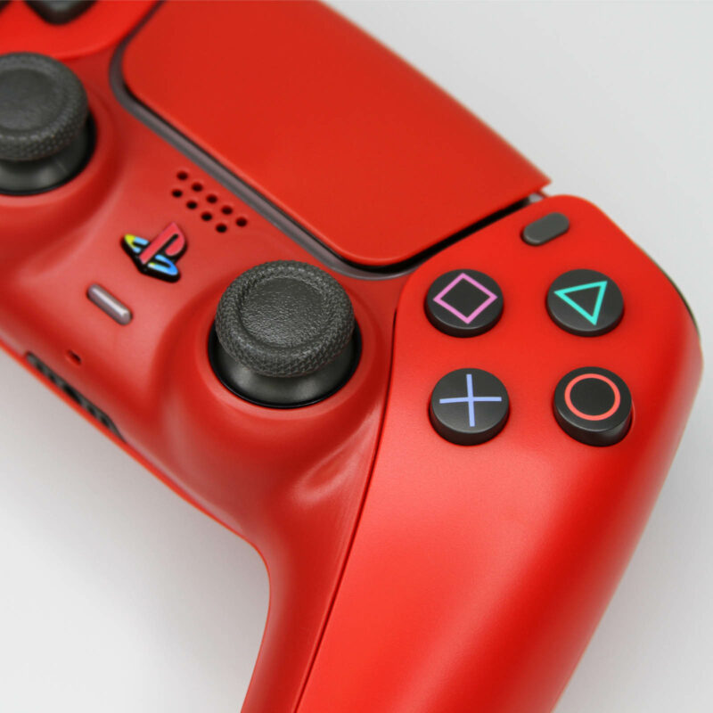 Close up of shape buttons on Killscreen Cinnabar Red PS5 DualSense Pro Controller