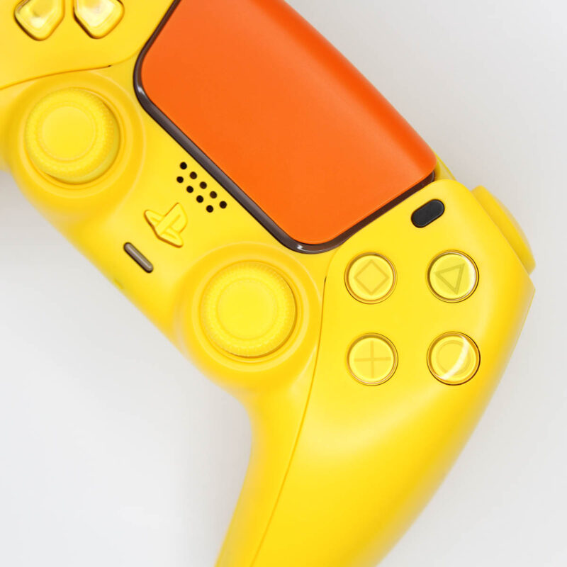 Close up view of Yellow and Orange Rubber Ducky PS5 Controller