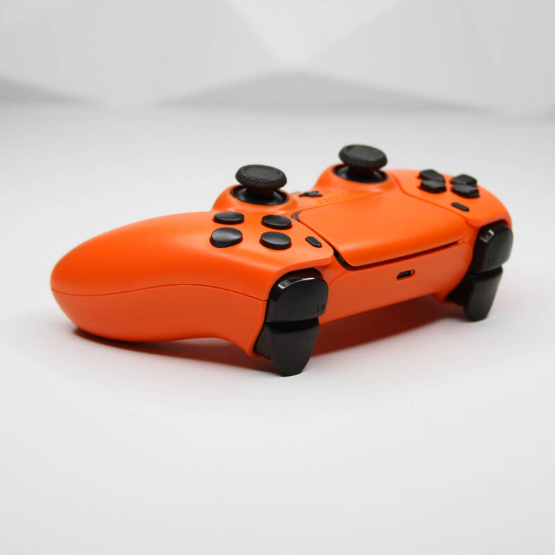 Action buttons view of Arancia Orange and Black Custom PlayStation 5 Controller