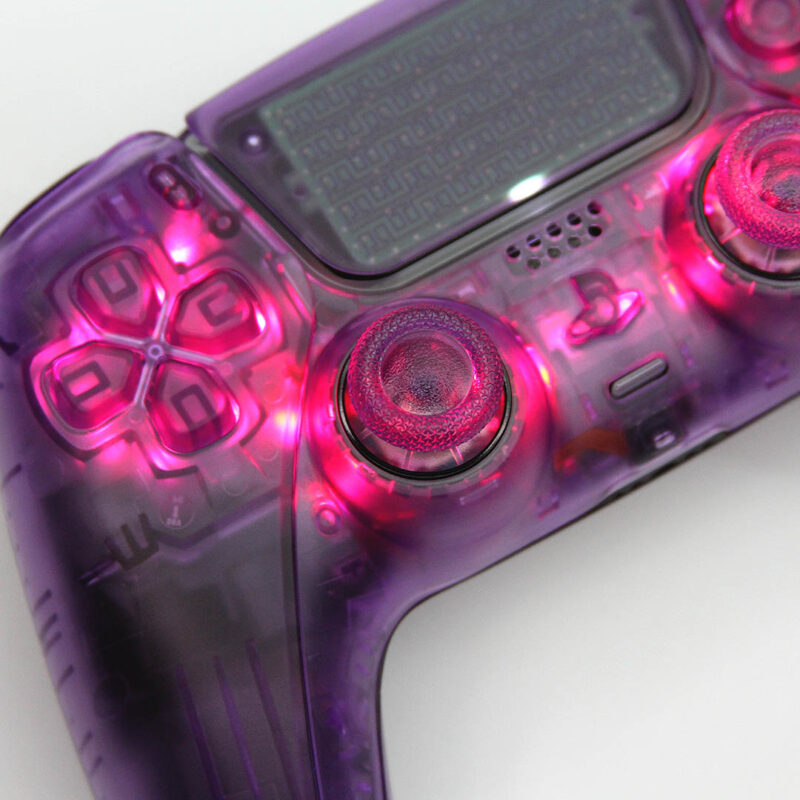 Close up of clear Atomic Purple LED PS5 Controller by Killscreen