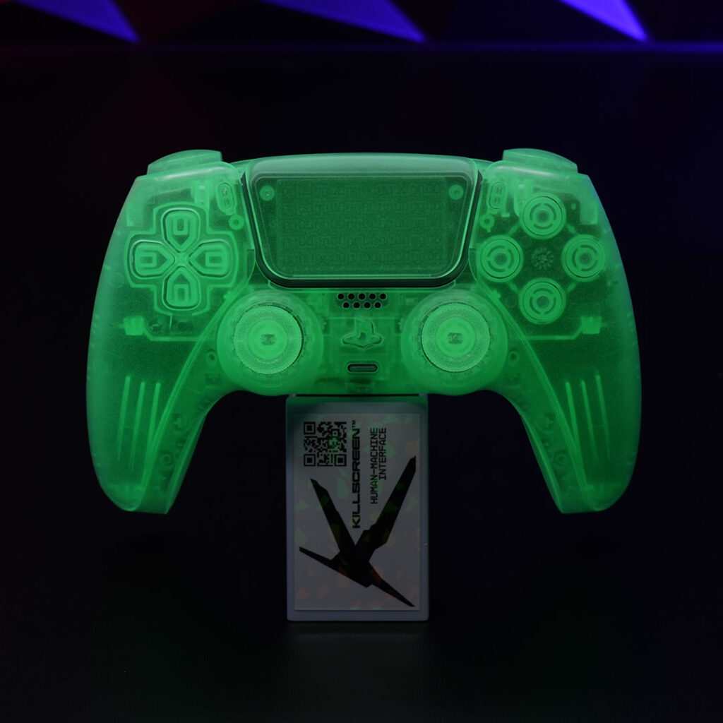 Killscreen GhoulSense glow-in-the-dark PS5 DualSense controller glowing vivid green in total darkness, centered on a stand with the Killscreen lab card beneath.